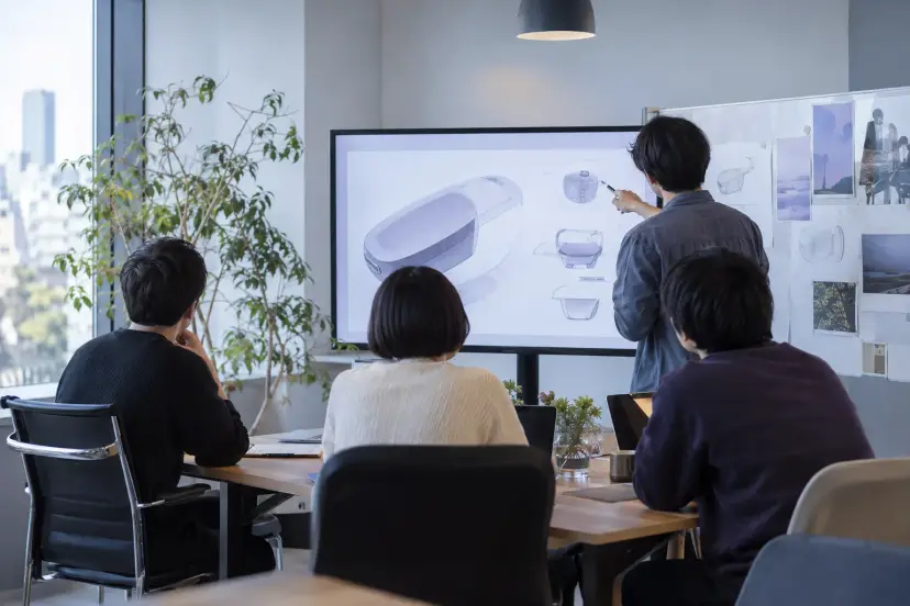 チームで働く様子のイメージ（AI で作成）